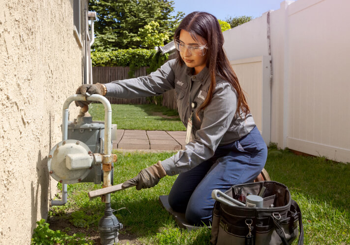 Woman working on Gas Meter