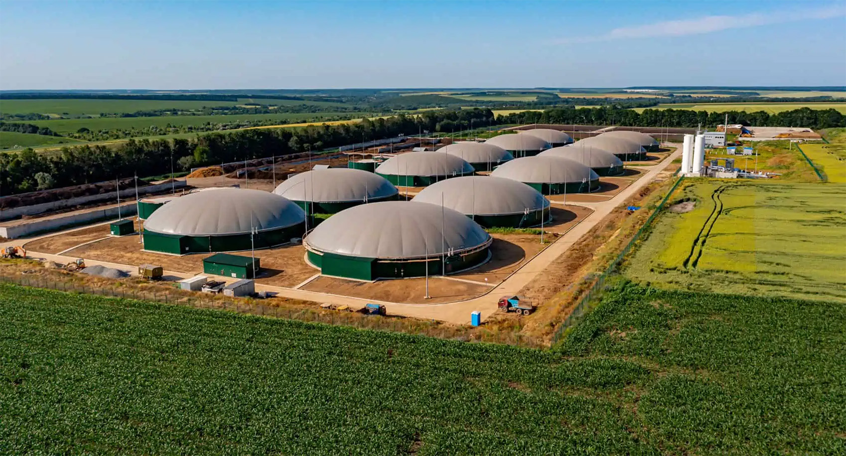 Several dome shaped buildings in a field