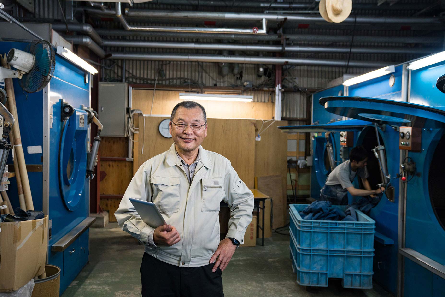 man smiling in laundromat