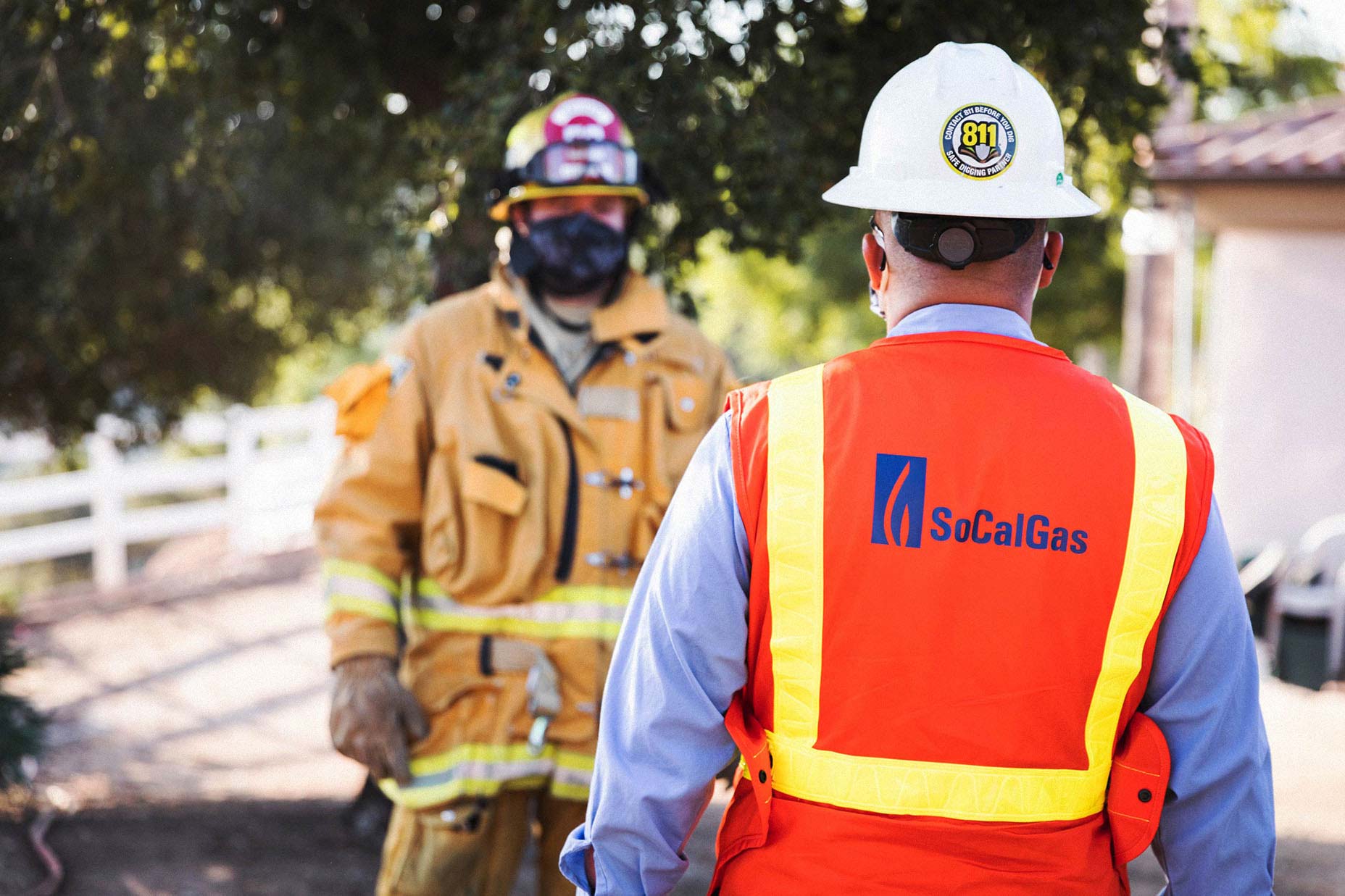 Firefighter speaking to SoCalGas employee