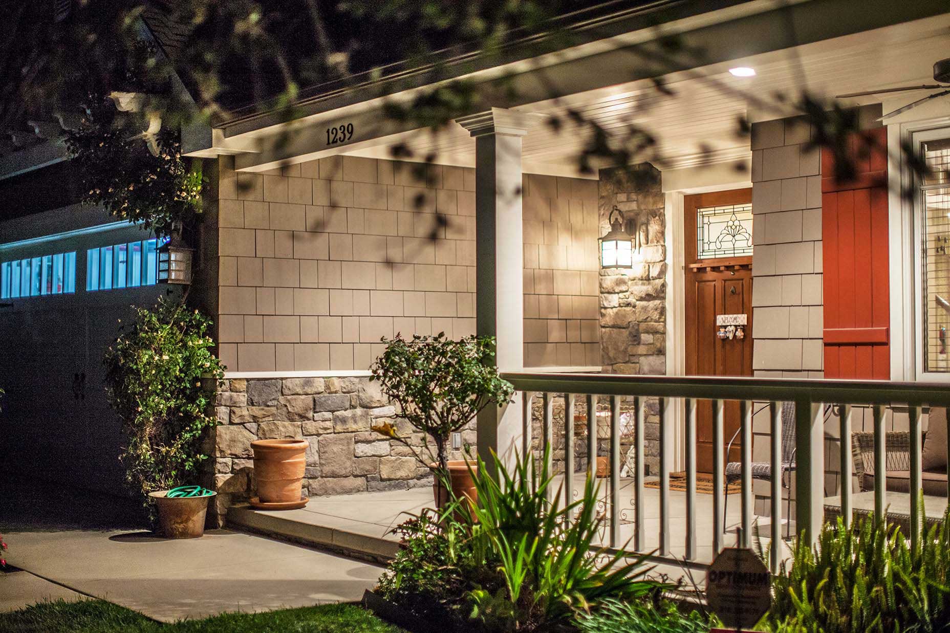 porch with lights in front of residential home