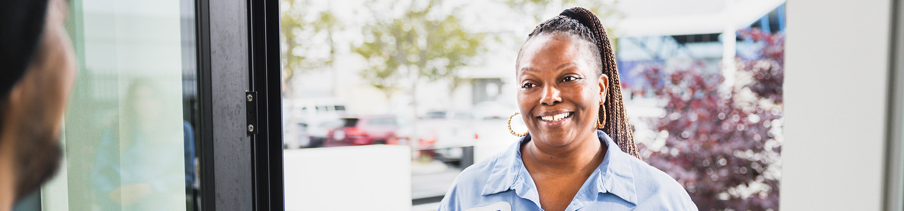 socalgas female employee at front door smiling