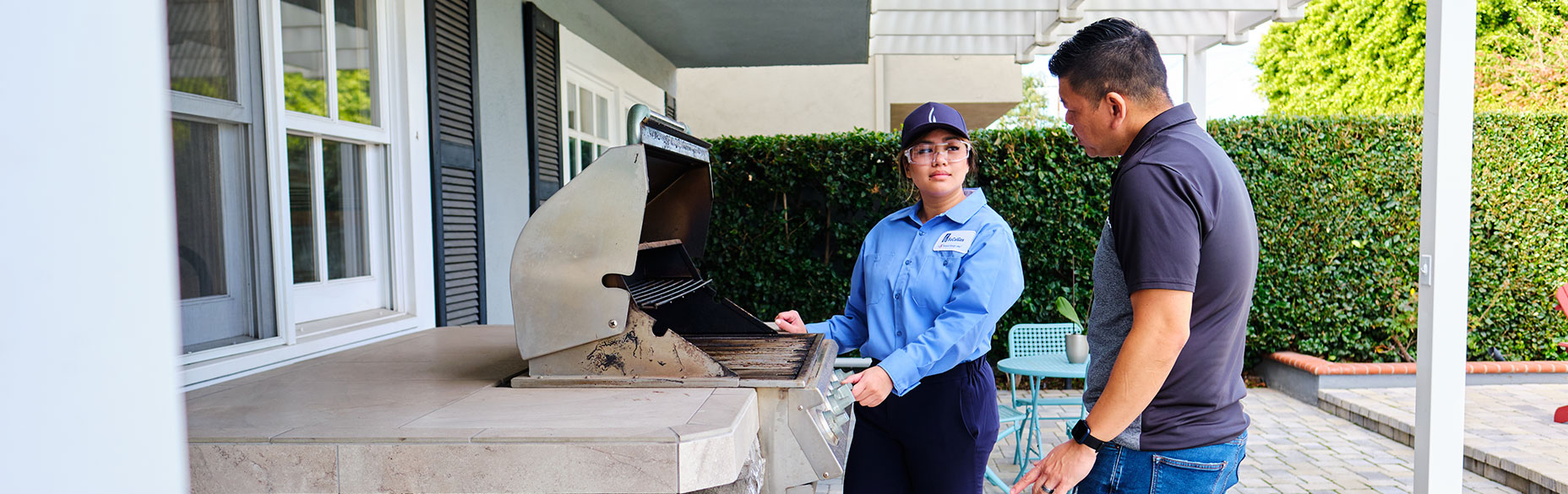 woman-employee-with-resident-by-grill