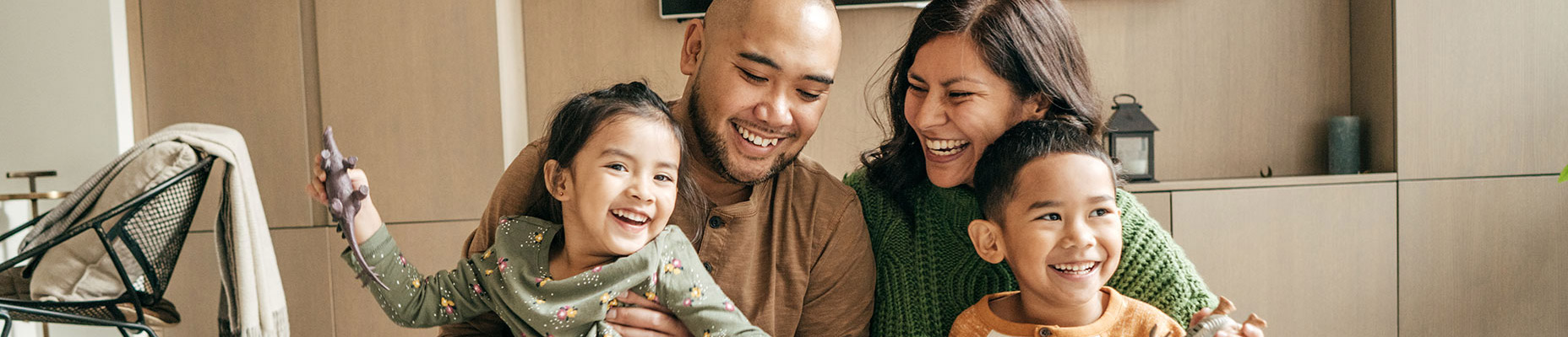 family smiling in home