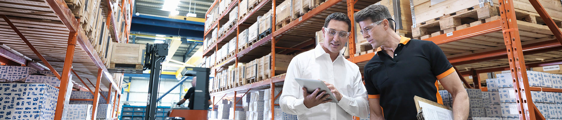 men with safety glasses in warehouse