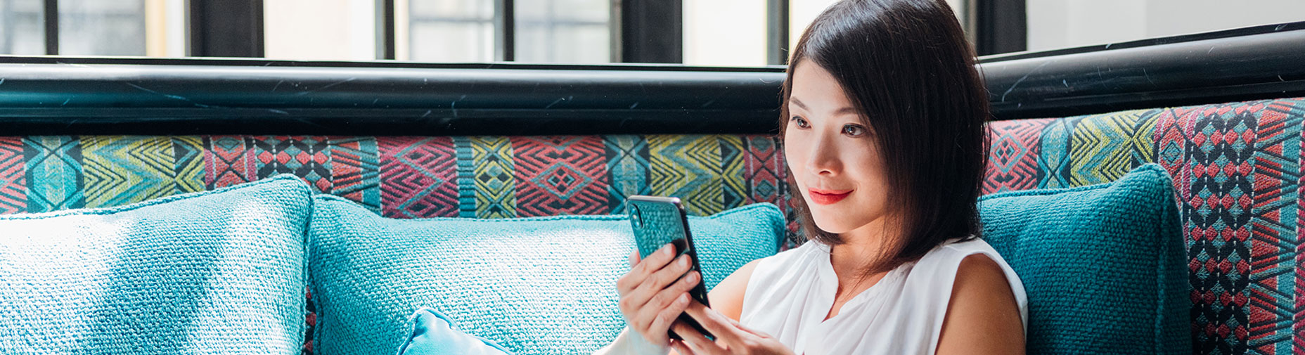 Woman Seated Using Cellphone