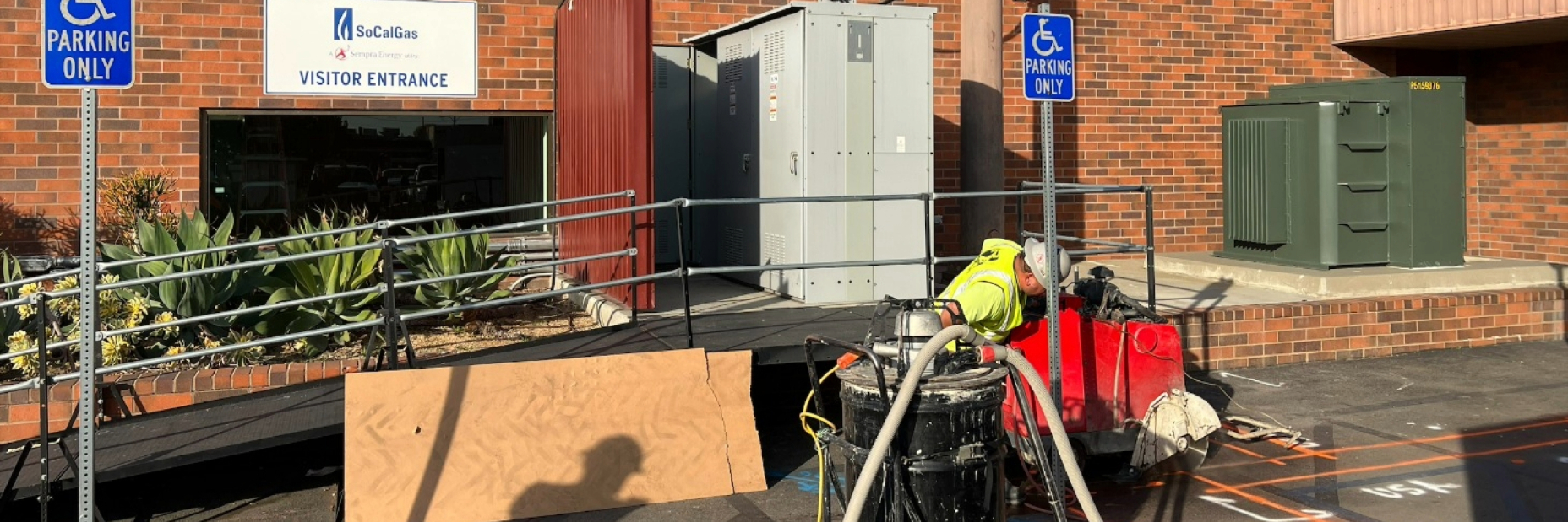 Workers moving in an electric vehicle charger