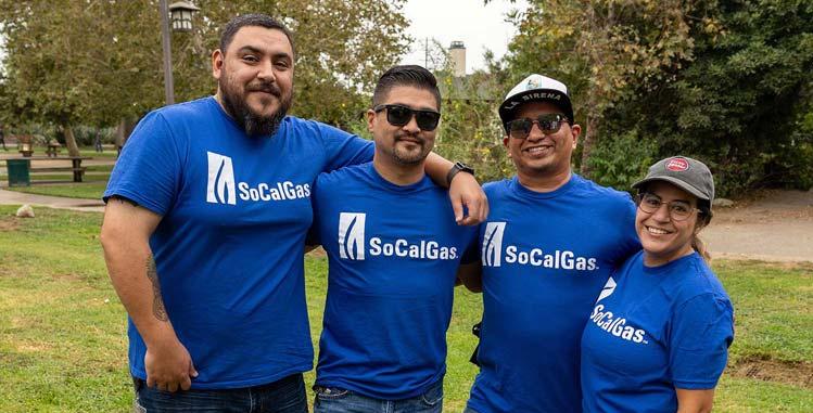 employees smiling group in park