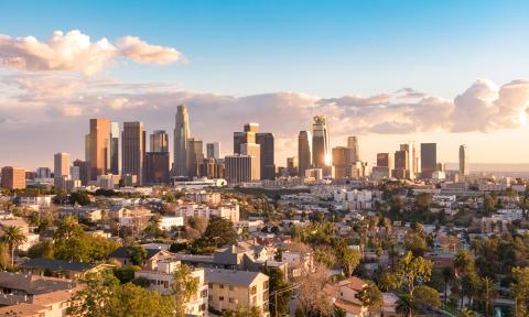 Sunny downtown los angeles skyline with clouds and blue sky in the background