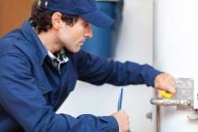 technician servicing water heater