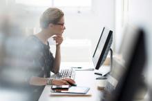 woman at desk on computer