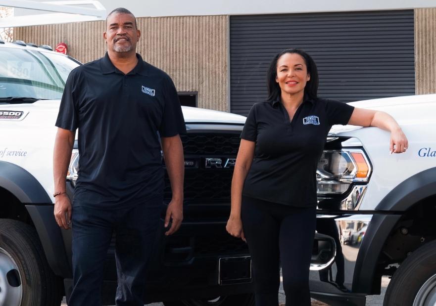 SoCalGas Workers Standing in Front of Work Trucks